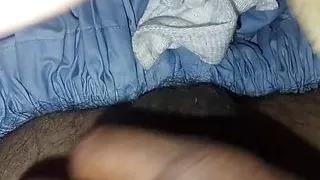 Very good looking guy rubbing his dick on his bed