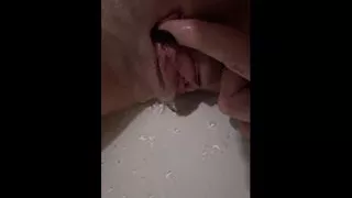 Decided to relax in the shower and jerk off my pussy with close-up shots