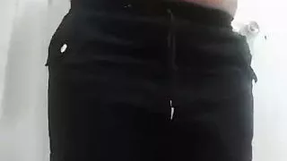 Busty aunt shows off her breasts and rubs her pussy before taking a shower