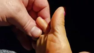 Little feet in daddy's big hands