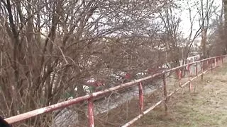 It's cold in the park and the young brunette with small