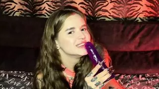 Cute chick sucks on her little toy