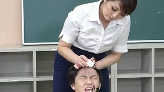 Masochistic man gets dominated by female as a wax doll in the classroom