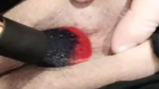 Tickling the clitoris with a brush