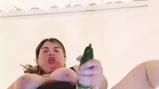 Hot mother fucks herself madly with a huge cucumber to squirt