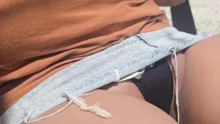 Naughty girl on the street with her legs open