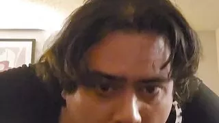 At the hotel playing alone.