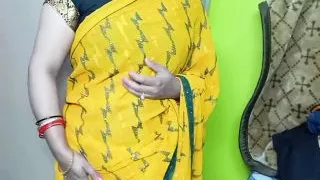 Beautiful bhabhi wearing yellow sari.