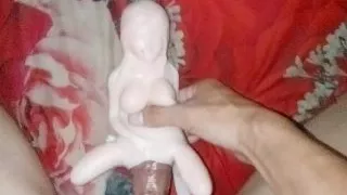 Putting a beautiful doll until crot on the face