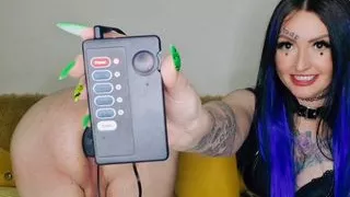 Review of a new sex toy. Anal electric plug for a slave's ass. Dominatrix Nika plays with electric vibrations with a sex slave