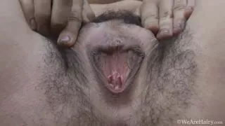 Lisandra strips naked on her outdoor balcony - WeAreHairy