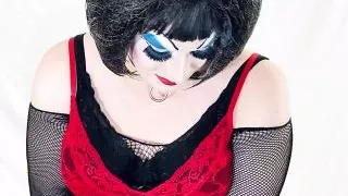 Heavy makeup drag slut strips to lingerie