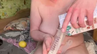 Milk enema spray on camera