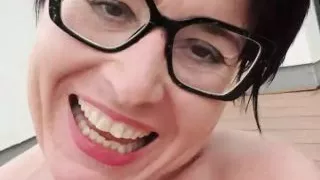 Milf Julie squirts with labia spreader through piercing