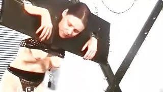 Chick trapped in suspension bondage from her woman punisher