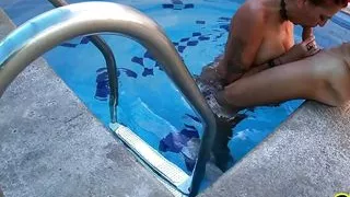 Redhead MILF Gets Two Cocks by the Pool