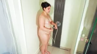 hot milf pissing and masturbating in the shower with shower head
