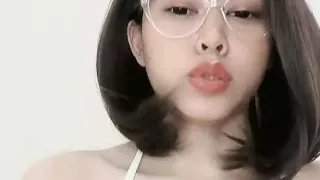 Glasses student squeezes small