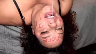 BBW colored girl DEEPTHROATING A dildo after writing dirty words on her whore face