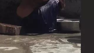 Desi sister-in-law is taking a bath in an open bathroom near the road on the edge of the forest on the farm