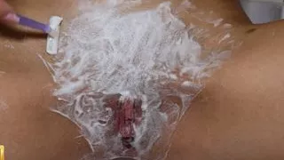 Beautiful blonde with natural tits shaves pussy! POV!