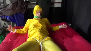 Watching Sexy Pia Being Tied And Gagged With Ropes On A Bed And A Clothgag Wearing Sexy Yellow Shiny Nylon Rainwear (Video)