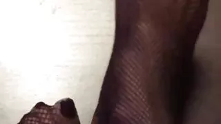 Really nice legs with tiny feet and long sexy toes wearing black Fishnet
