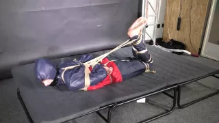 Myxxxy Bound And Gagged In Shiny Nylon Rainwear Trying To Free Herself