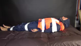 Sexy Sandra Being Tied And Gagged With Tape On A Bed Wearing Blue Rainwear And A Lifevest (Video)
