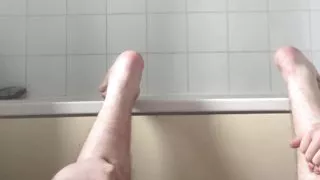 Fat boy sticks shower tube up his ass and fills himself like a balloon