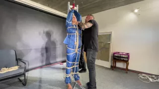 Ms Ungeniert Tied, Gagged, Suspended Ind A Shiny Nylon Rainsuit And Finally Bullwhipped