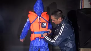 Ronja Being Tied And Gagged Overhead Wearing Sexy Shiny Nylon Rainwear And A Lifevest Being Lifted Up And Dominated By Stella (Video)