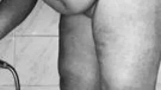 Chubby MILF shaves her pussy in the shower