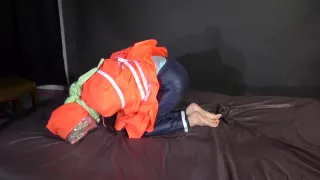 Sexy Sonja Being Tied, Gagged And Hooded On A Bed With Belts And A Cloth Gag Wearing Shiny Nylon Rain Pants And A Rain Cape (Video)