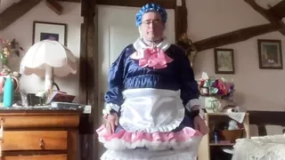 In a blue maid outfit with pink bows for a day