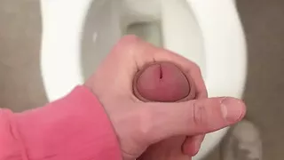 Twink wixes his big cock on the toilet
