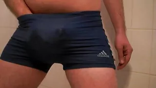 Jerking off and cumming through my Adidas swimming trunks