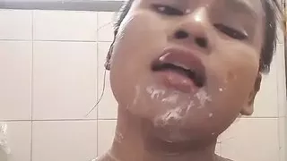 Asian girl shower and sucking banana in bathroom