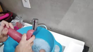 Camgirl showing everyday life, talking and cleaning toys