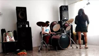 They play the drums for her - she dances, stripping and showing her ass