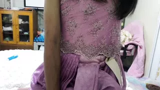 Ladyboy in pink Thai dress