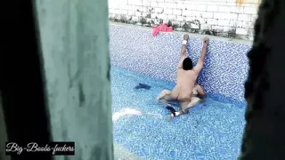 A neighboring couple was seen secretly having sex in the swimming pool.