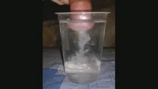 I release white swirling clouds of thick semen into the water in slow motion