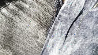 Hammock wetting in gray leggings under tattered jeans