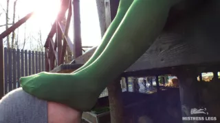 My nylon feet in green tights on your face