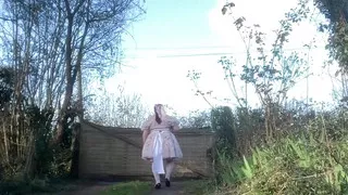 In a babydoll outfit to pee a second time in the diaper outside