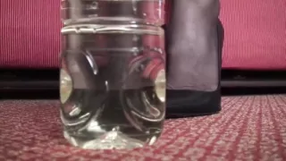 Beautiful milf pissed in the bottle and sprays her slave