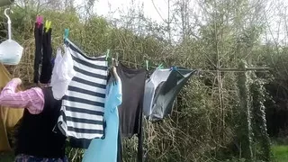 In outfit shirt tie and skirt to hang laundry outside part2