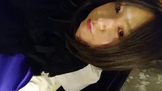 A cross-dressing boy in a black dress wore black full-body tights on the inner layer and purple full-body tights over it, making him look like a mascot character.