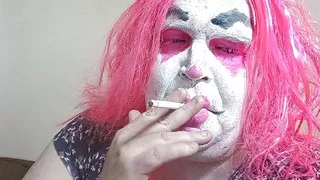 Femme TV clown smokes and gives jerk off instruction